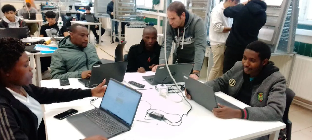 Trainers and trainees in workshop